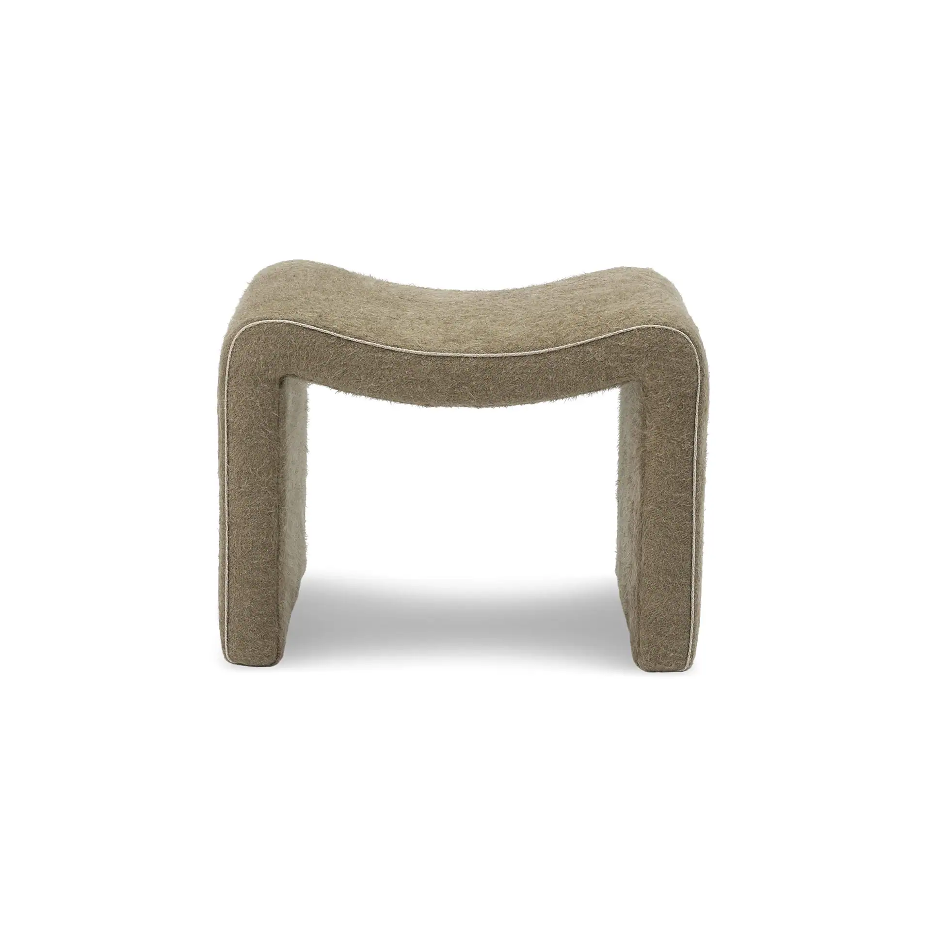 Sklar Furnishings Isla Ottoman in beige fabric with curved design.