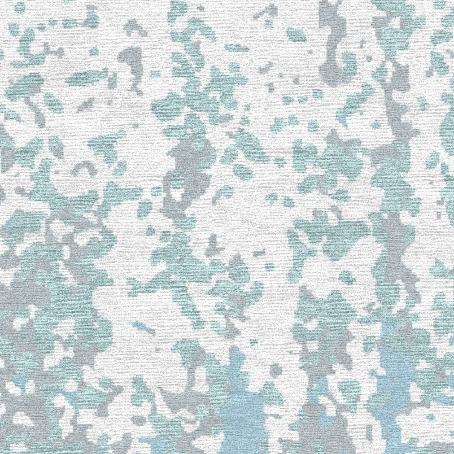 Abstract pattern area rug with blue, gray, and white colors.