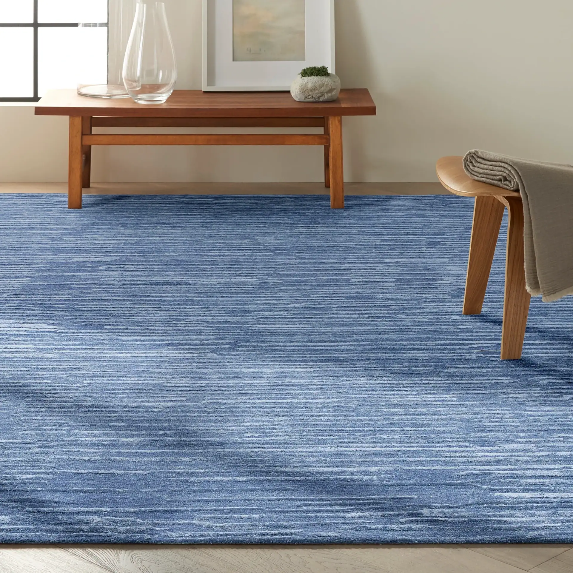 Sklar Furnishings CK010 Linear Area Rug in blue in living room.