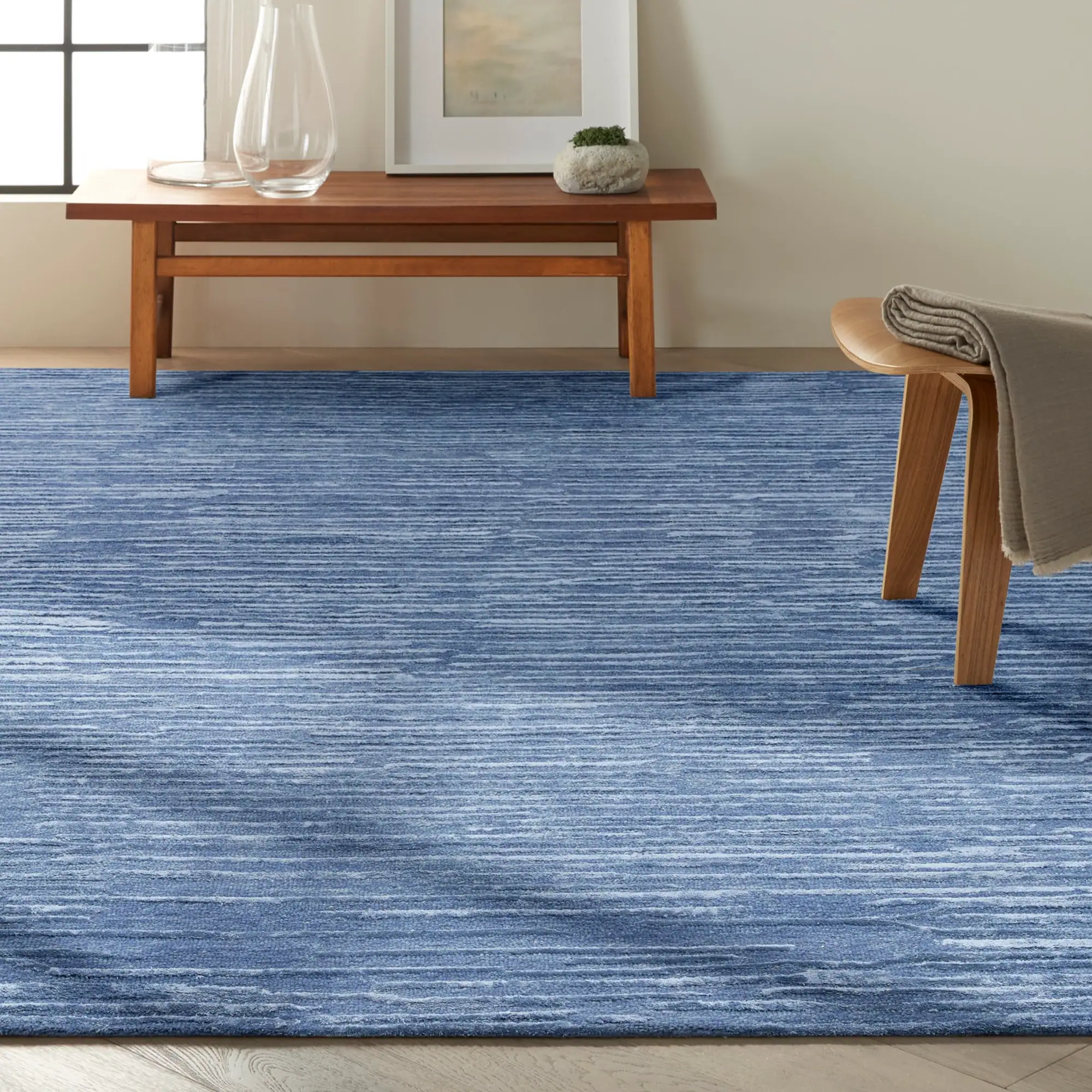 Sklar Furnishings CK010 Linear Area Rug in blue in living room.