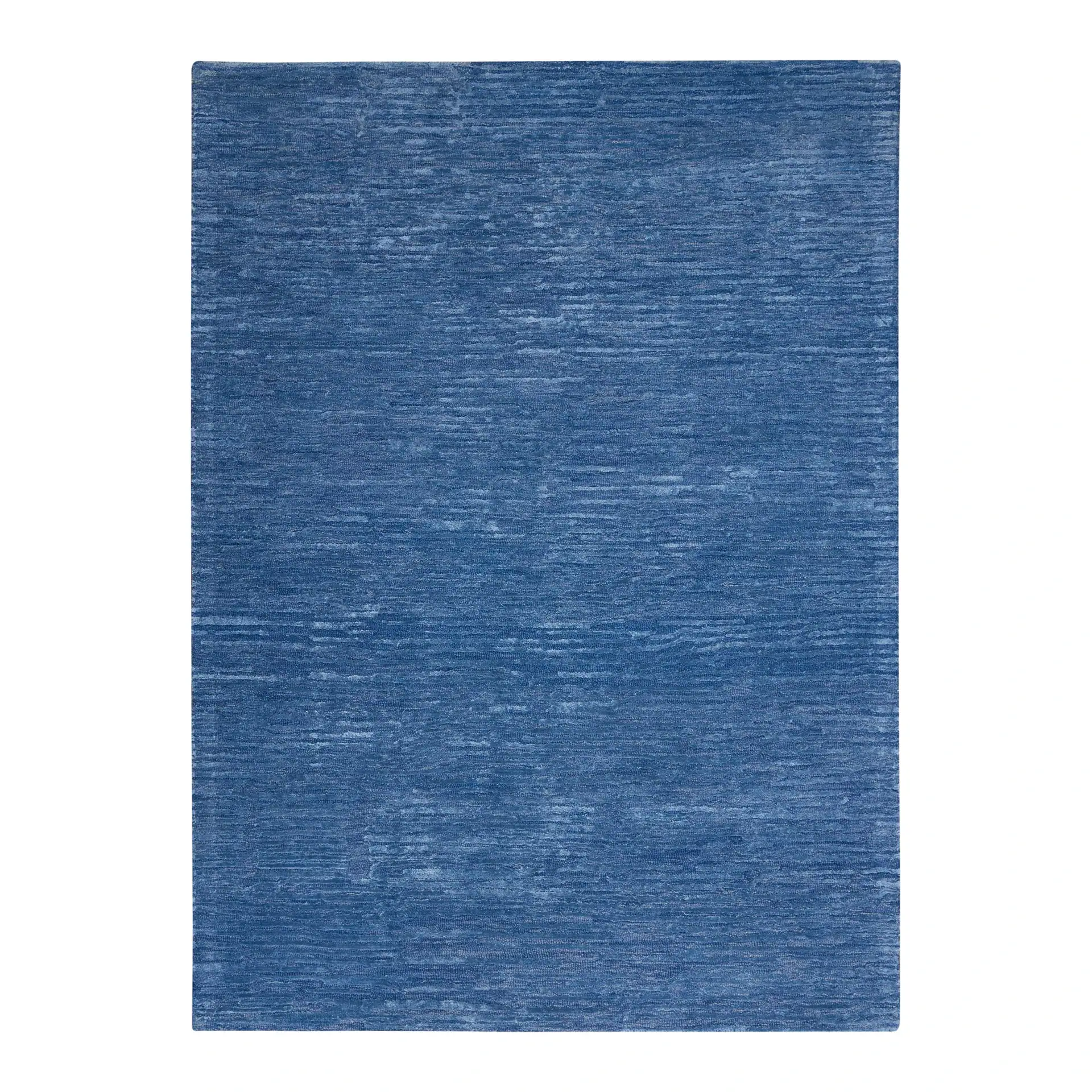 Sklar Furnishings blue area rug with textured pattern.