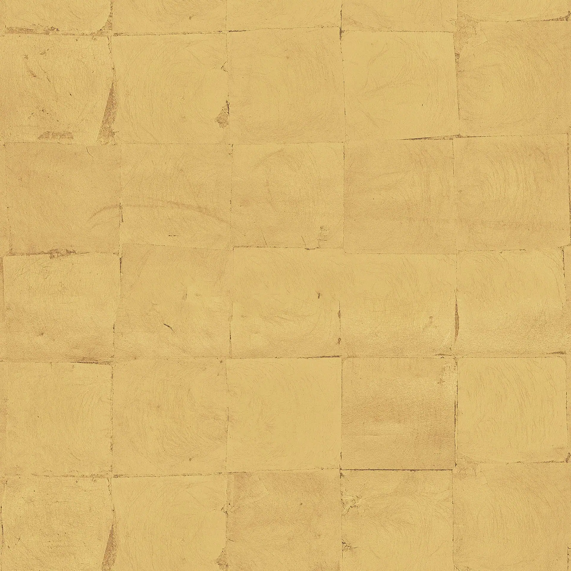 Close-up of metallic leaf wallpaper with a gold finish and textured surface.
