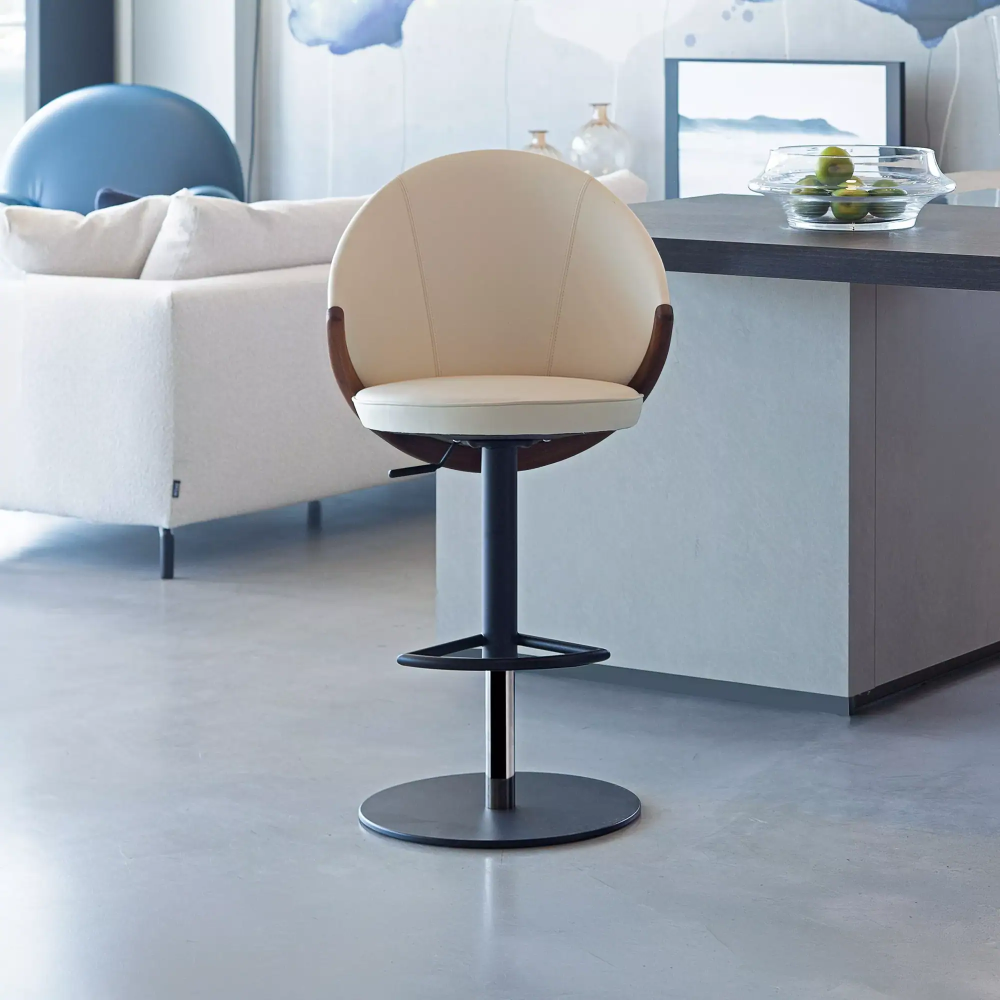Sklar Furnishings Bow adjustable bar stool in a modern kitchen setting.