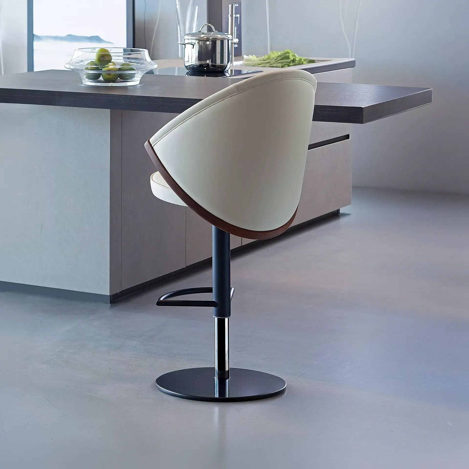 Sklar Furnishings Bow adjustable bar stool in a modern kitchen setting.