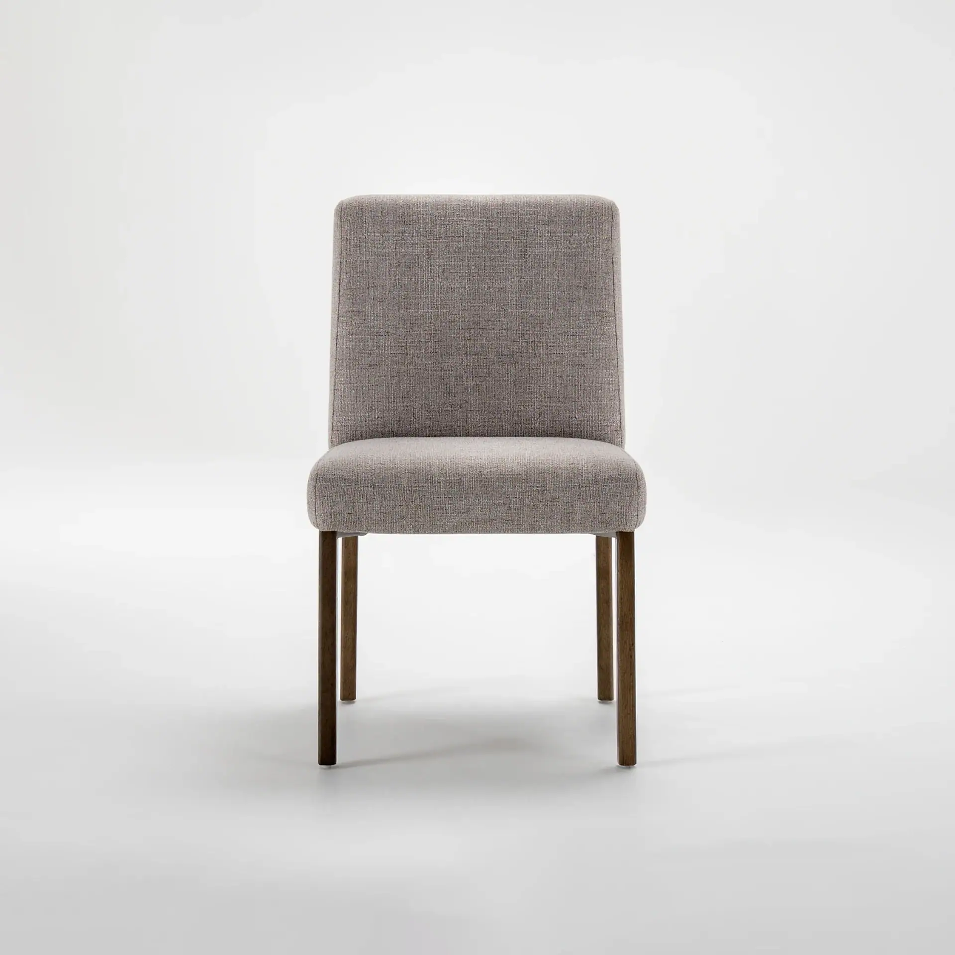 Front view of a light gray upholstered dining chair with dark brown wooden legs on a white background.