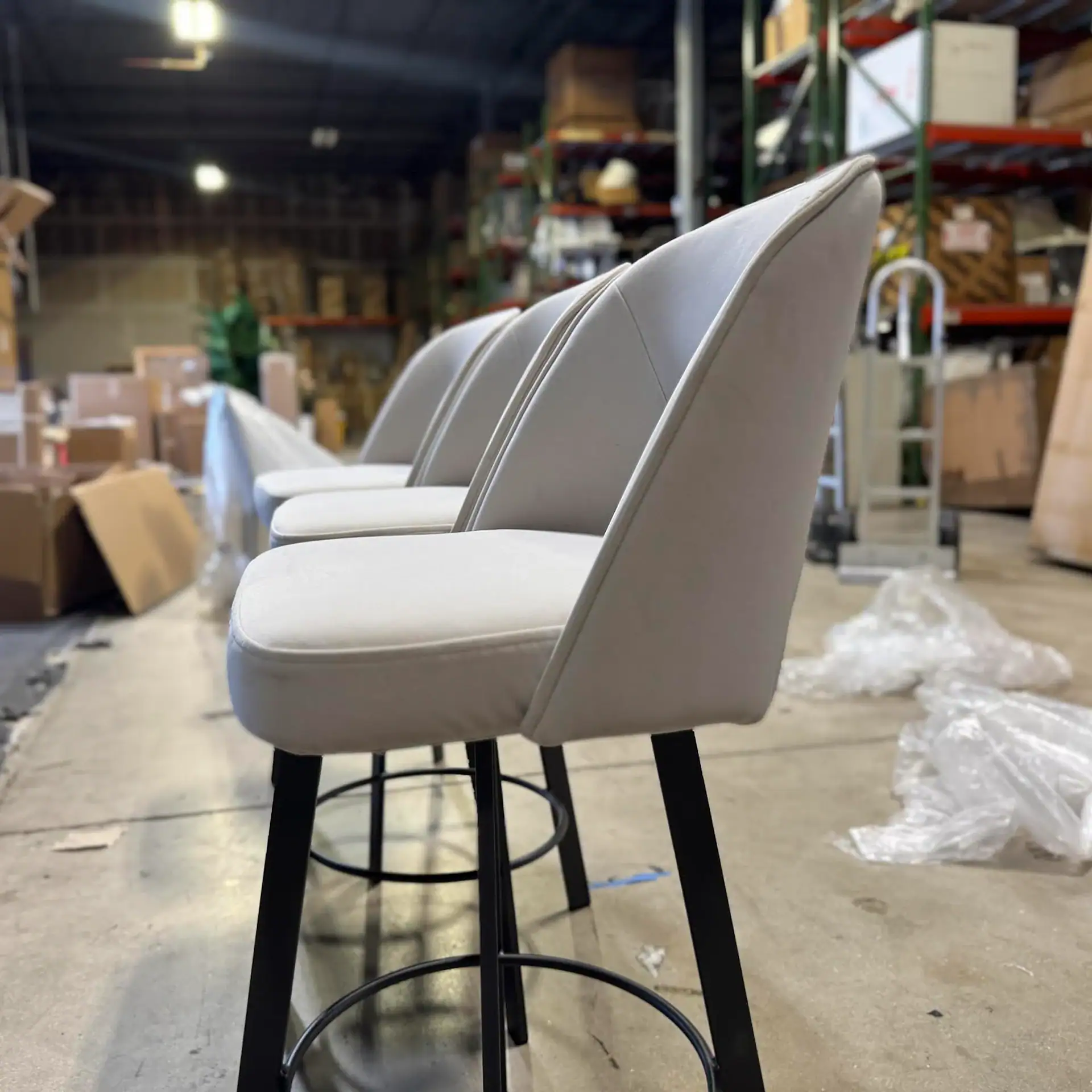 Trica Mia swivel counter stool in a warehouse setting.