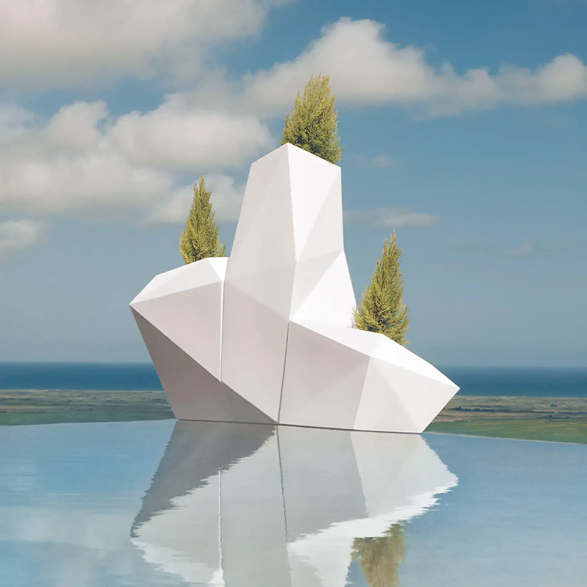 Abstract white sculpture with trees on top against a blue sky.