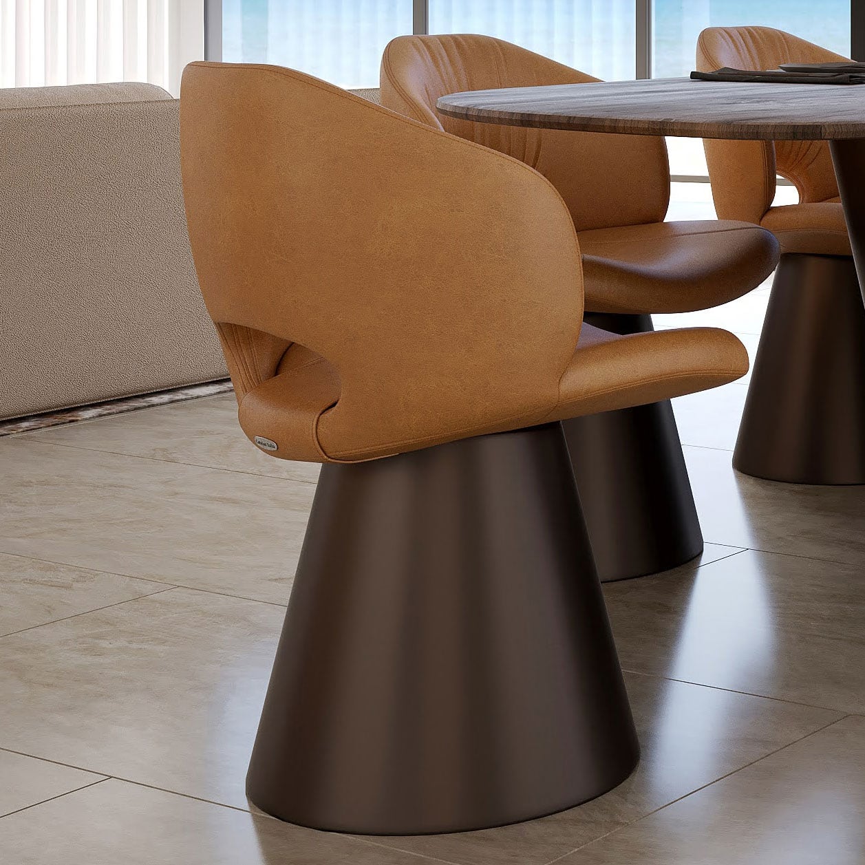 Sklar Furnishings modern dining chair with tan upholstery and black base.