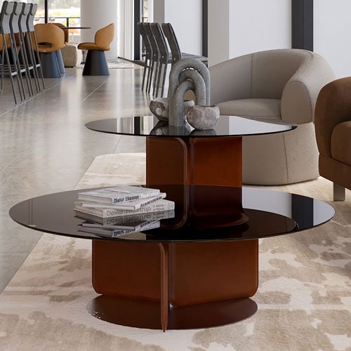 Sklar Furnishings modern coffee table with black glass top and brown base in living room.