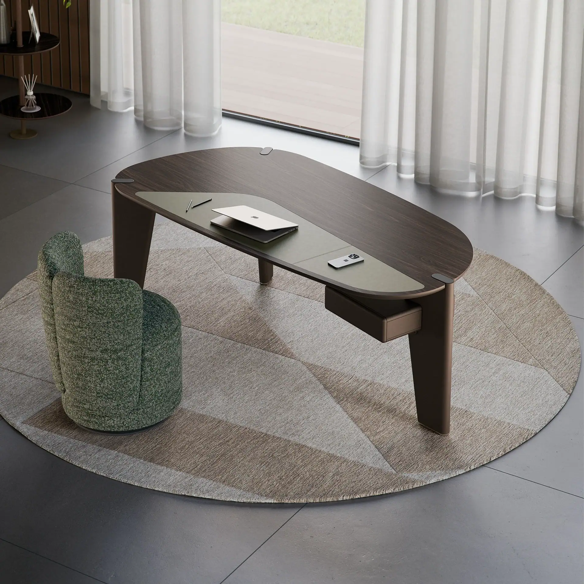 A modern dark wood desk with a green leather pad, a silver laptop, and a green armchair on a geometric rug in a bright room with sheer curtains.
