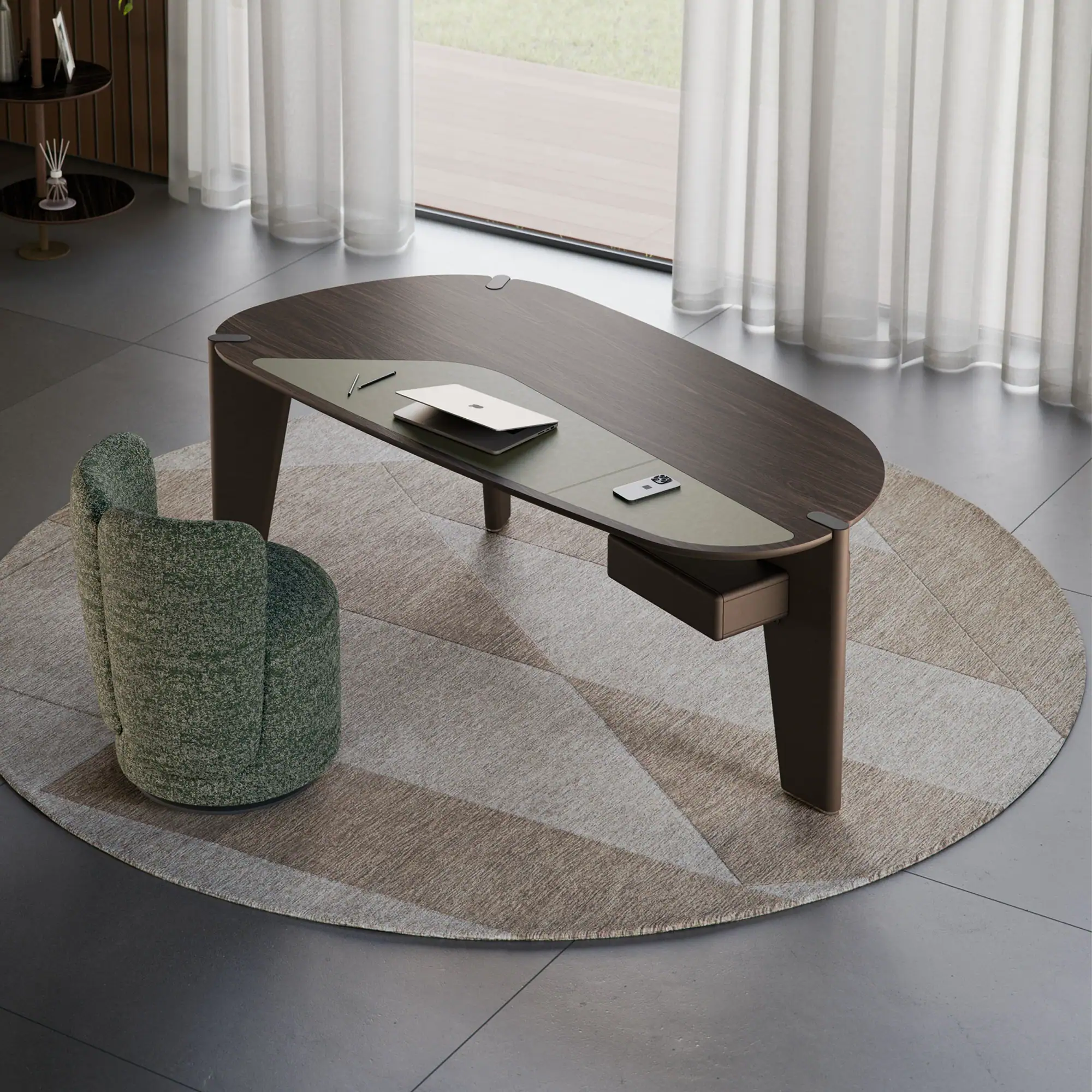 A modern dark wood desk with a green leather pad, a silver laptop, and a green armchair on a geometric rug in a bright room with sheer curtains.