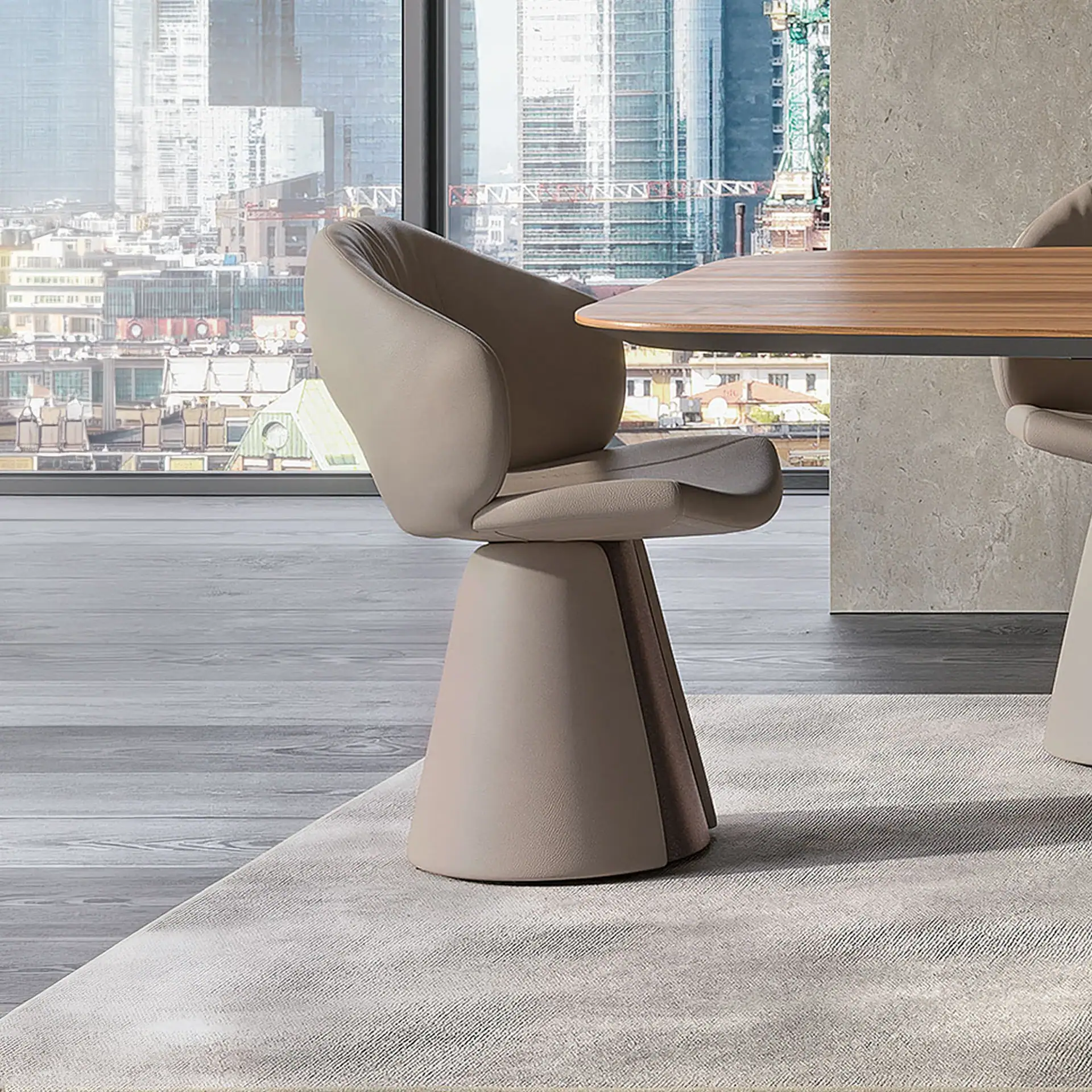 A modern light beige upholstered chair with a conical base sits on a rug in front of a large window overlooking a city skyline.
