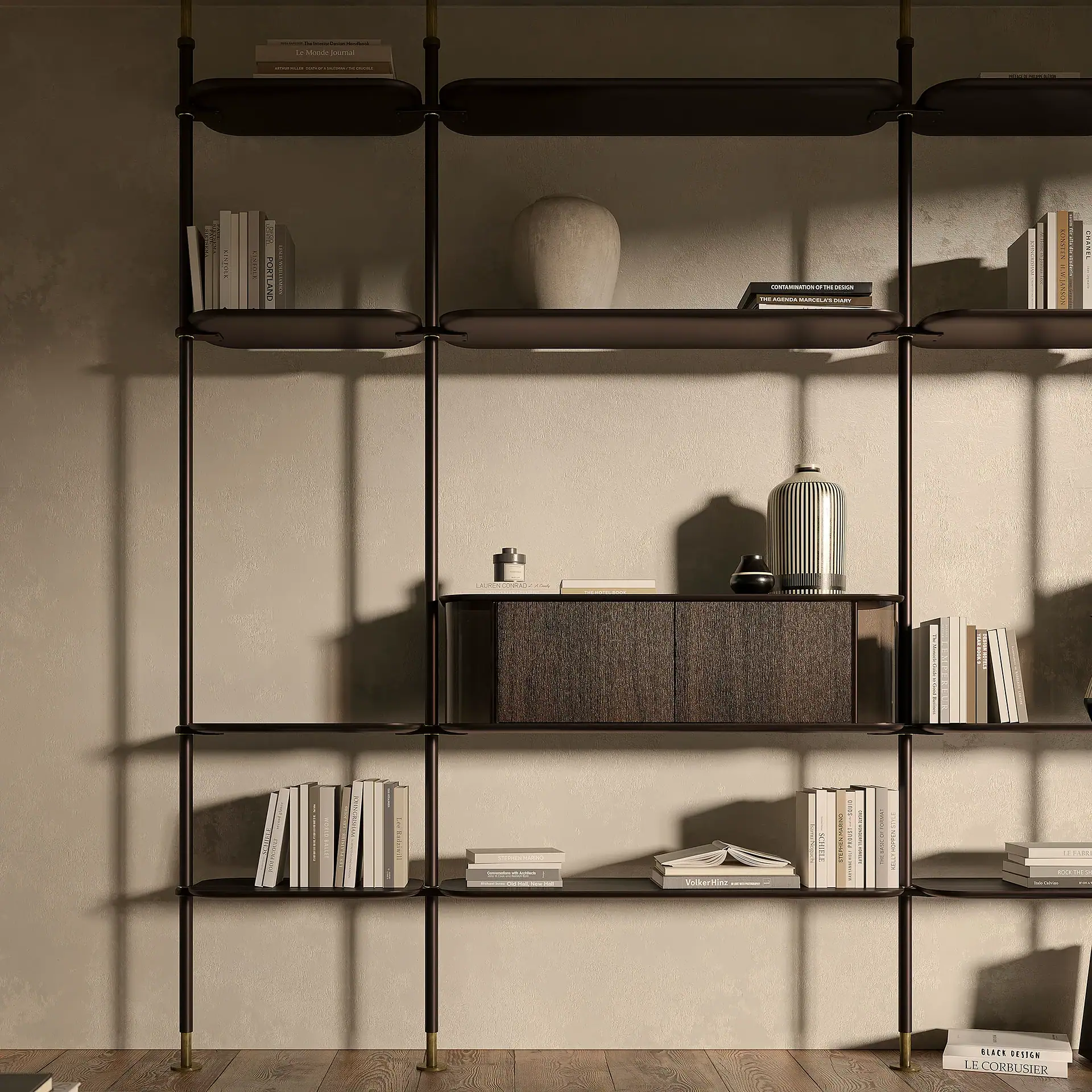 A modern dark modular shelving unit filled with books and decorative vases against a light textured wall and wooden floor.