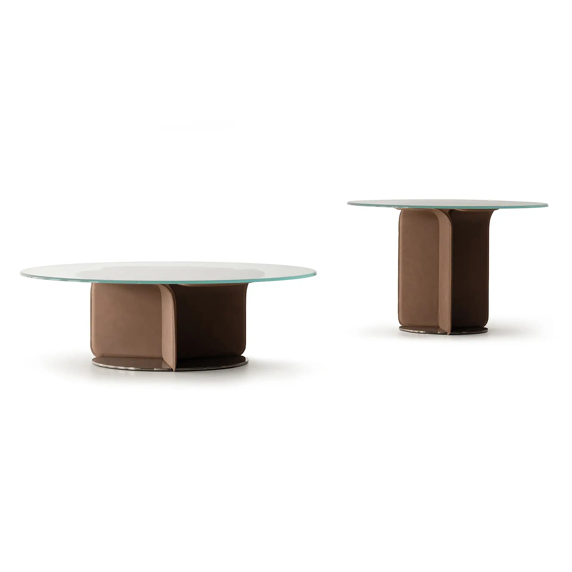 Two modern tables with round glass tops and curved brown leather bases, one short and wide, the other tall and narrow, on a white background.