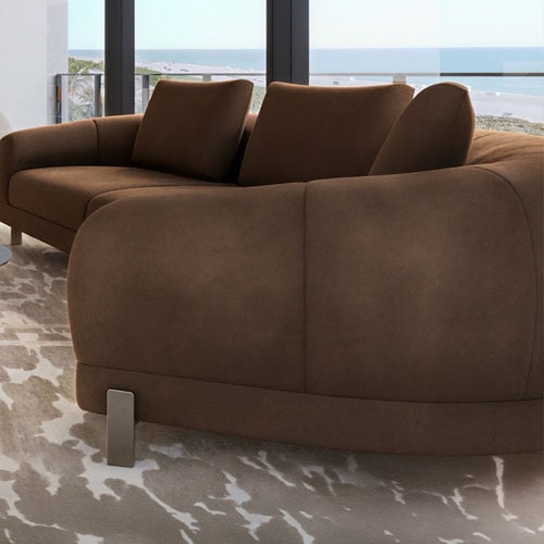 Sklar Furnishings brown sofa with cushions in a modern living room.