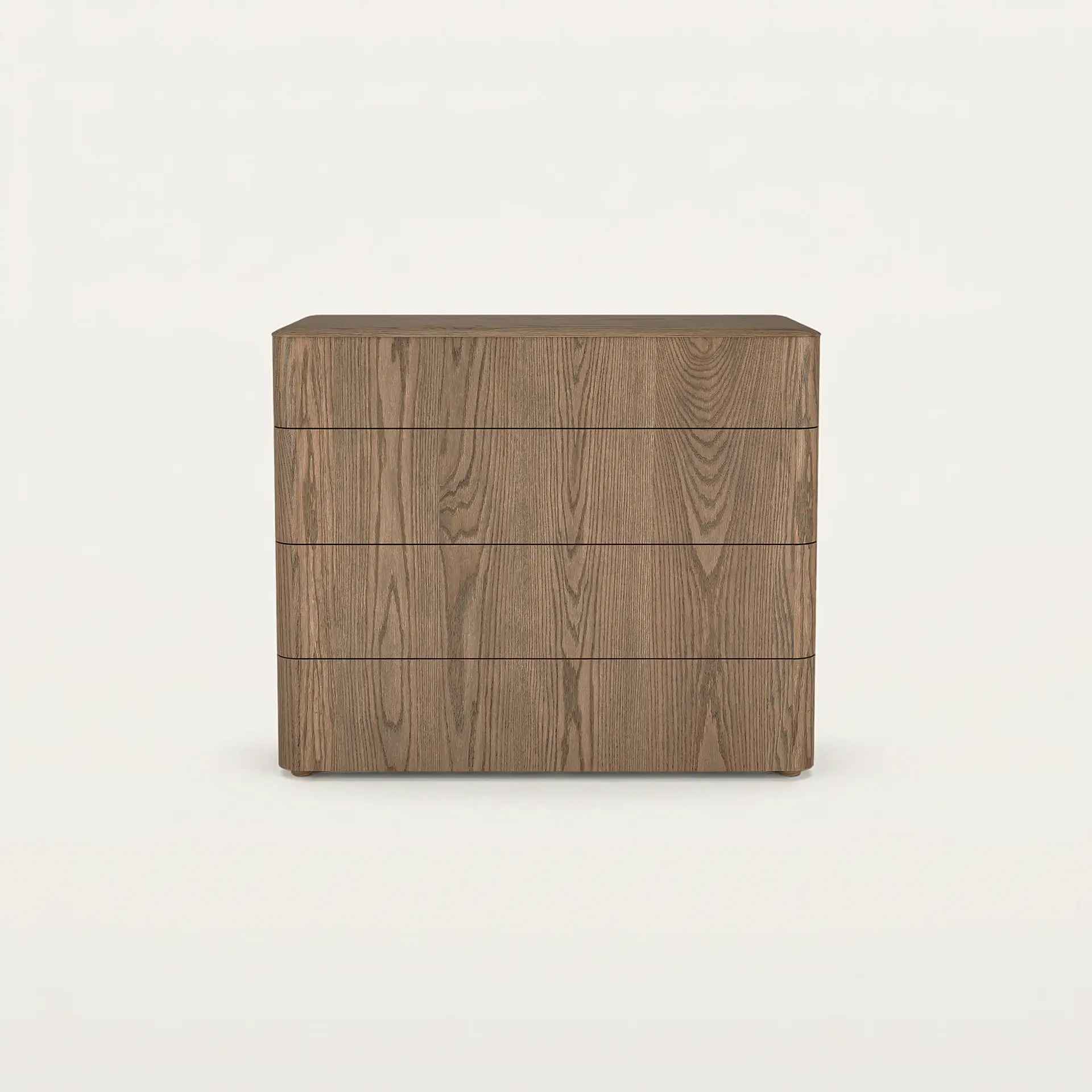 A light brown wooden chest of four drawers with rounded corners and no visible handles, set against a white background.