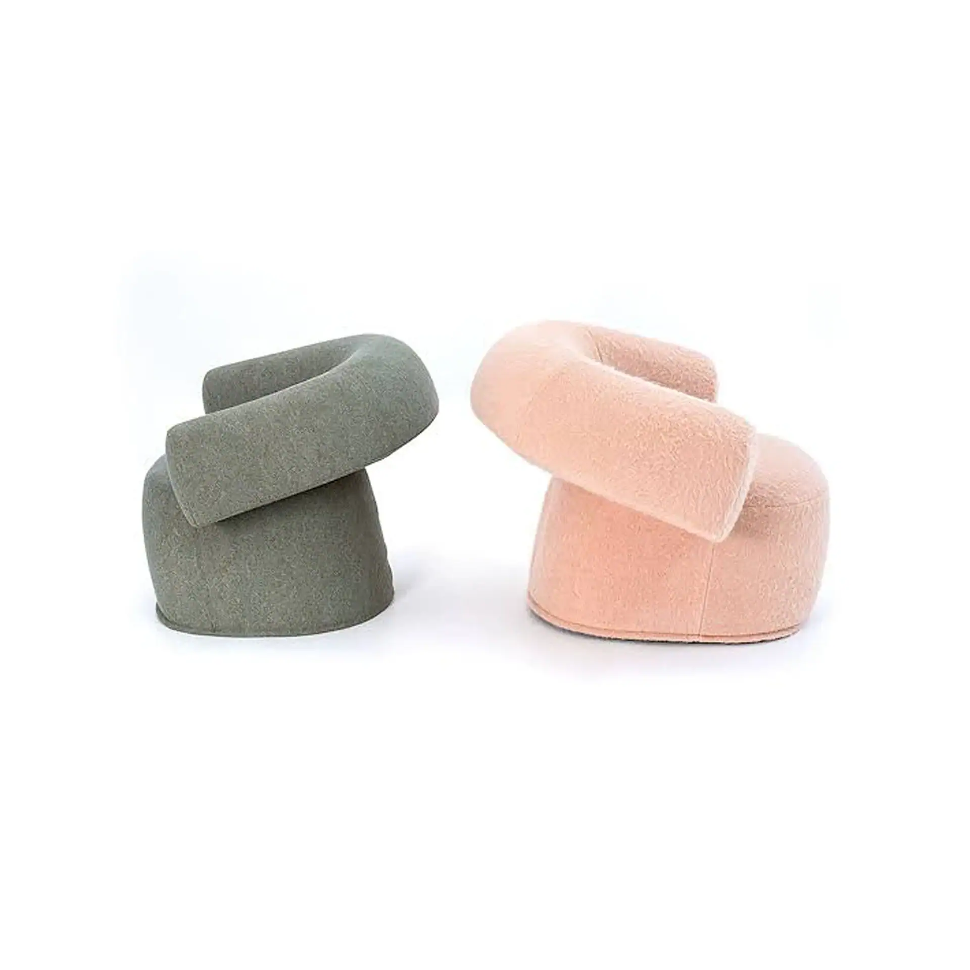 Two abstract, C-shaped chairs, one olive green and one light pink, on a white background.