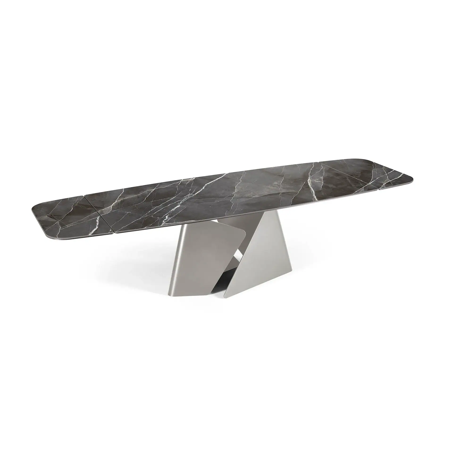 A modern dining table with a dark gray marble top and a geometric, sculptural metallic base on a white background.