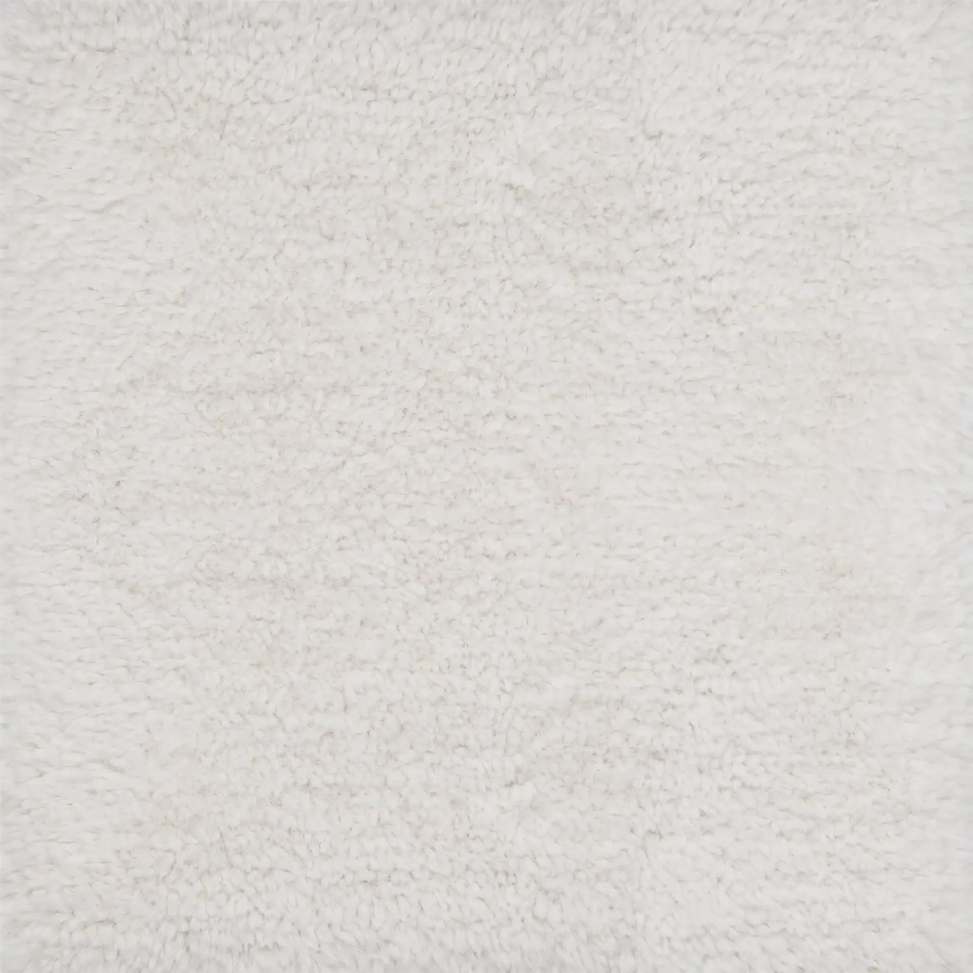 Close-up of a fluffy, off-white or light cream-colored textured surface, resembling fleece or a shaggy rug.