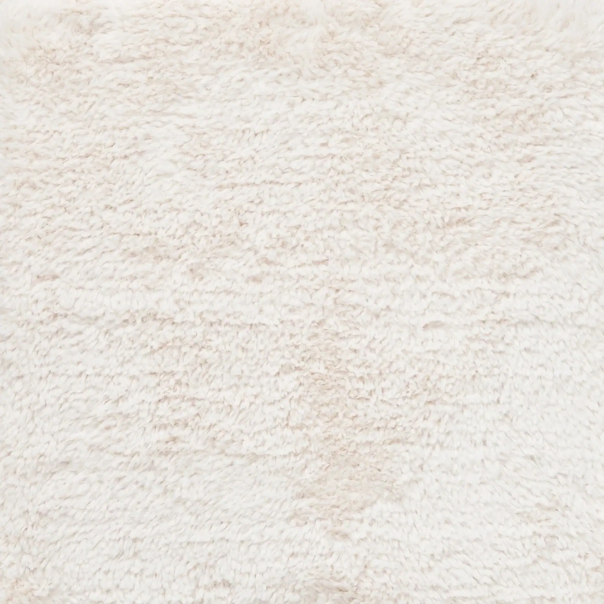 Close-up of a white, fluffy, and soft texture, resembling fleece or a plush rug.