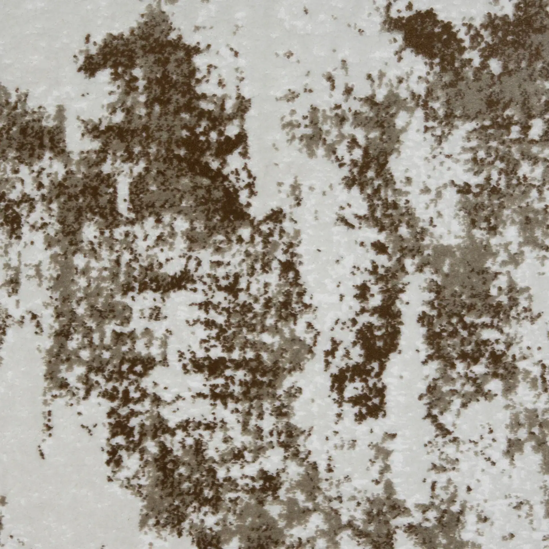 Close-up of a textured surface with an abstract mottled pattern in dark brown, light brown, and off-white.