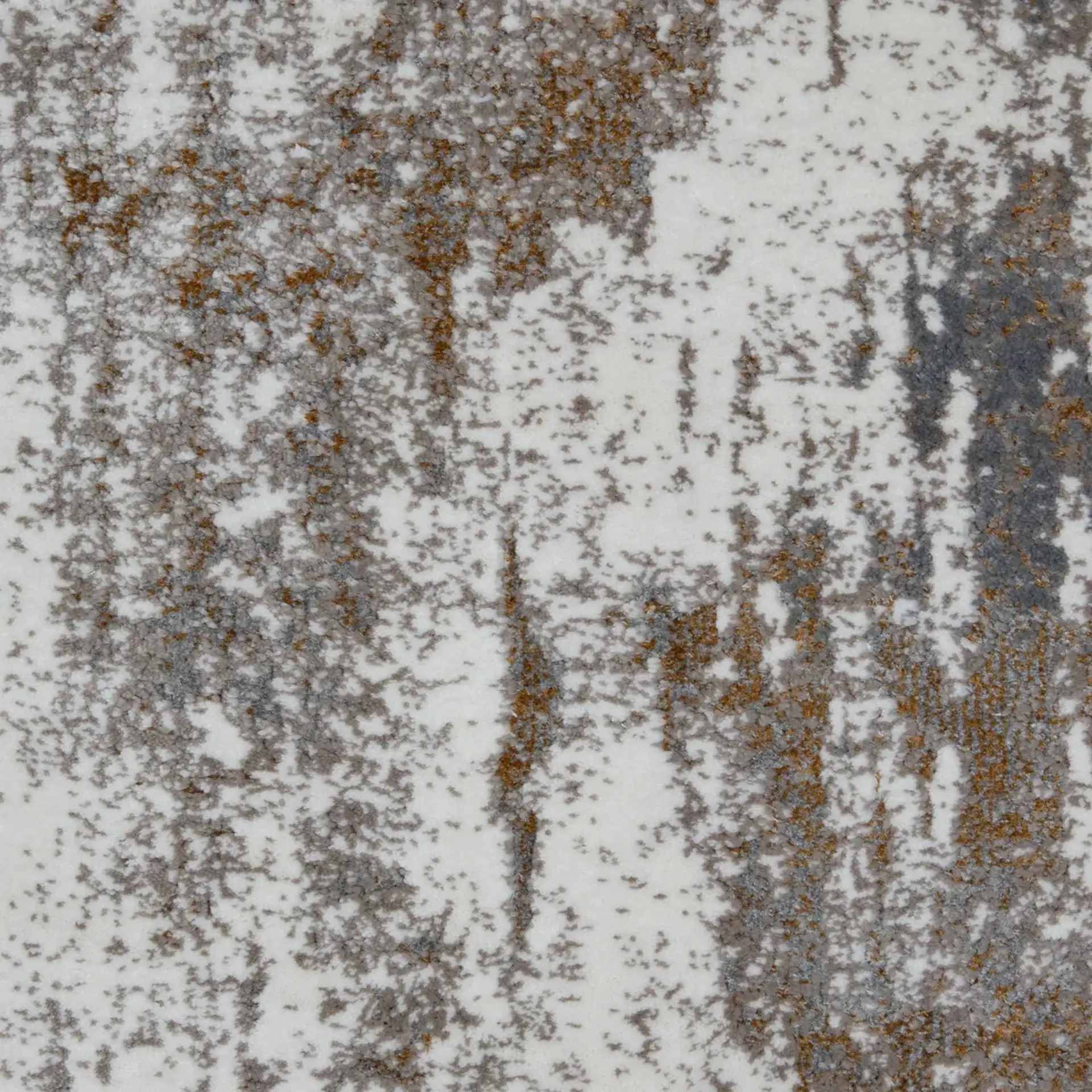 Close-up of an abstract textured surface with mottled patterns in white, gray, and rusty brown.