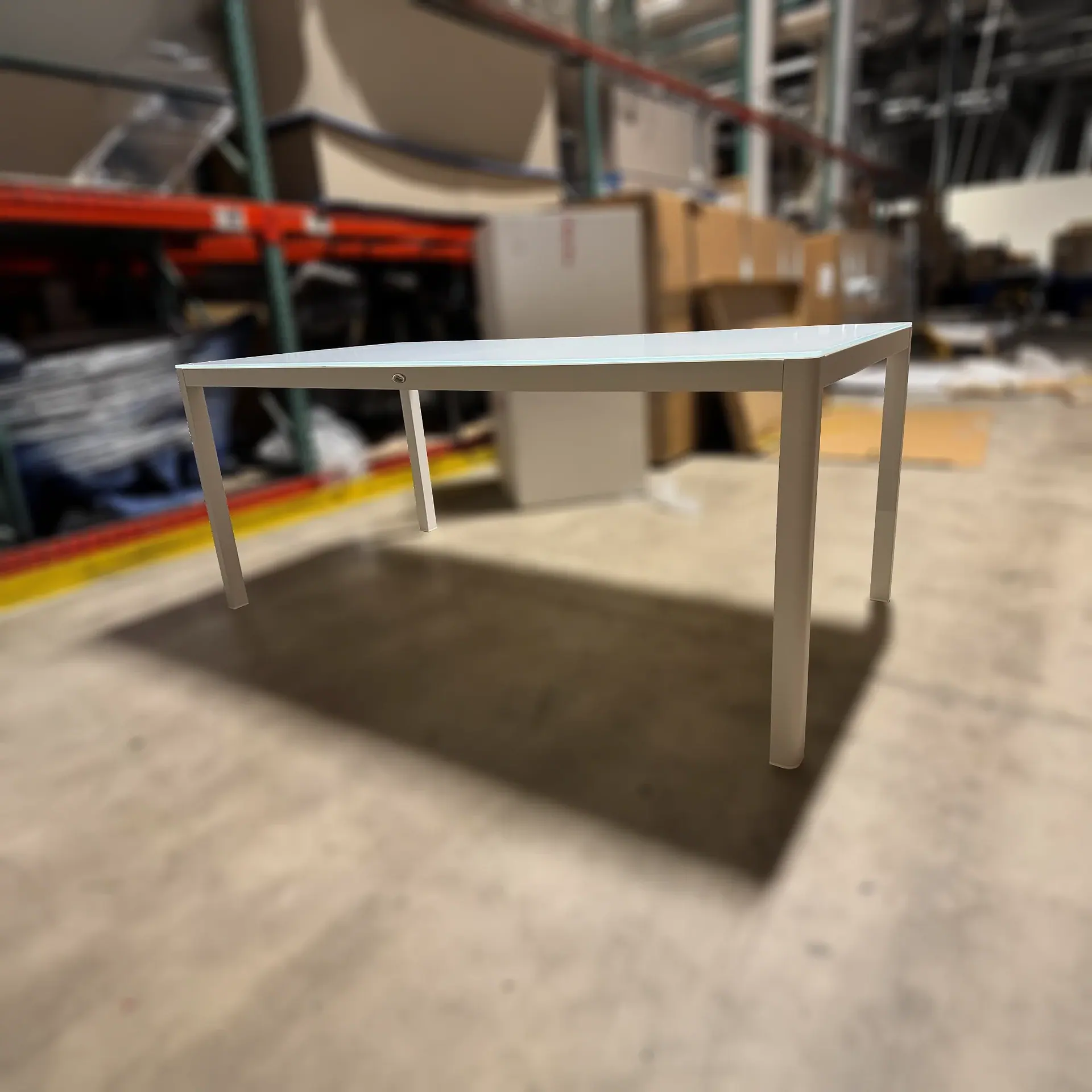 Sklar Furnishings table in a warehouse.