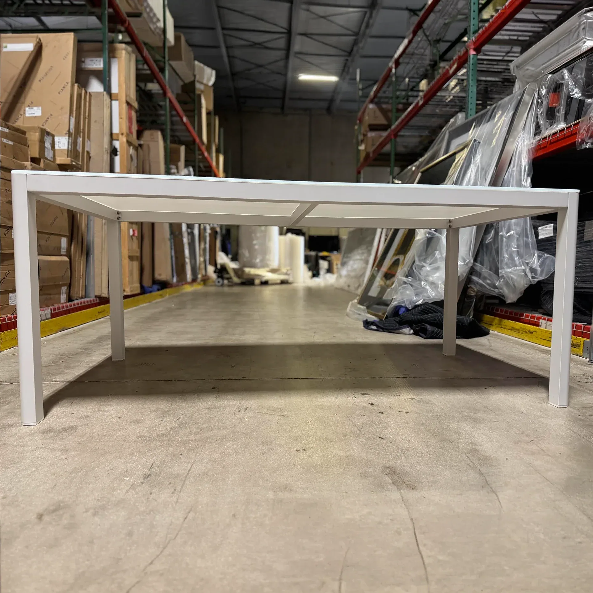 Sklar Furnishings table in warehouse setting.