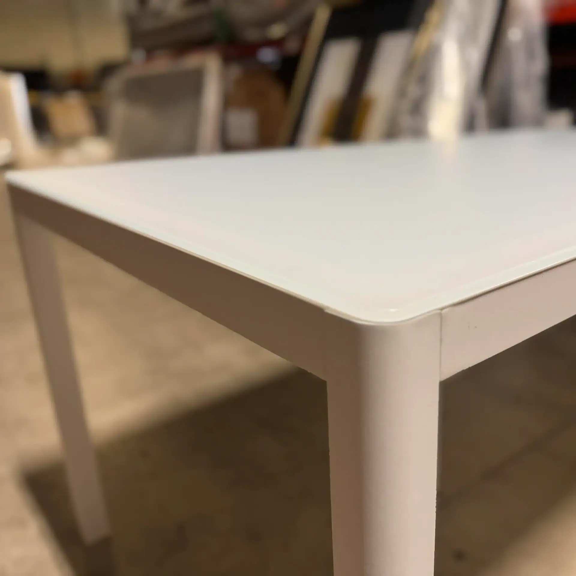 Sklar Furnishings table edge and leg in a white finish.