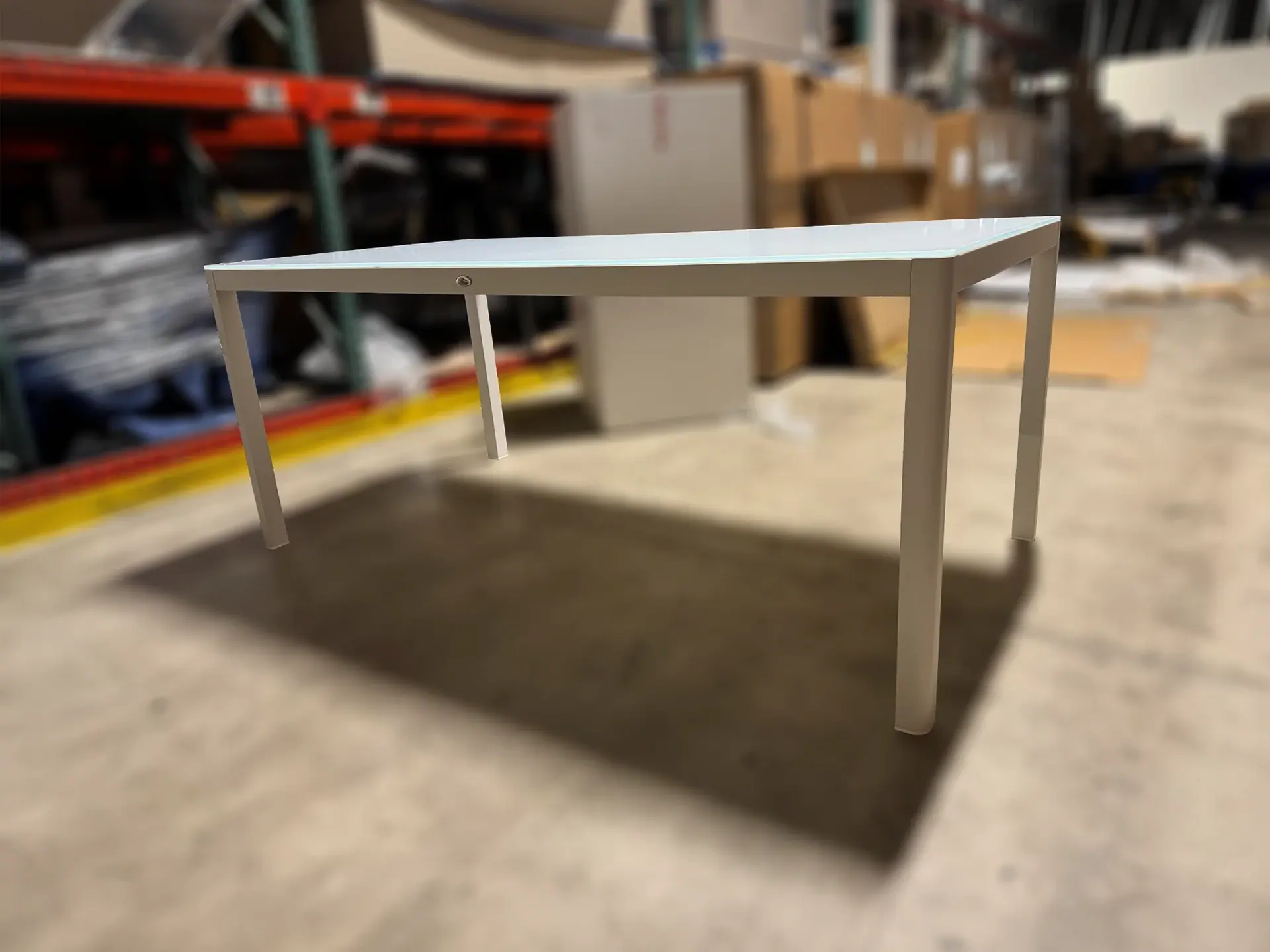 Sklar dining table in a warehouse setting.