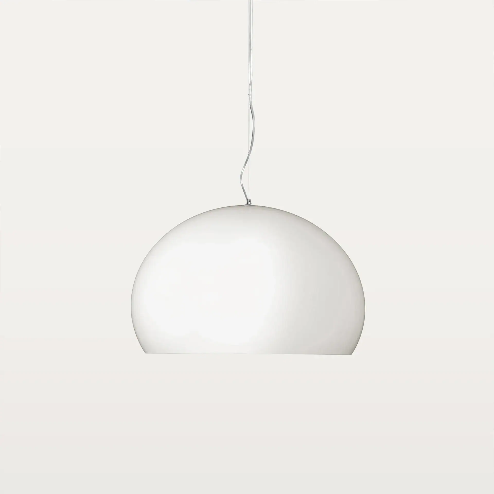 A white spherical pendant light hangs against a light grey background.
