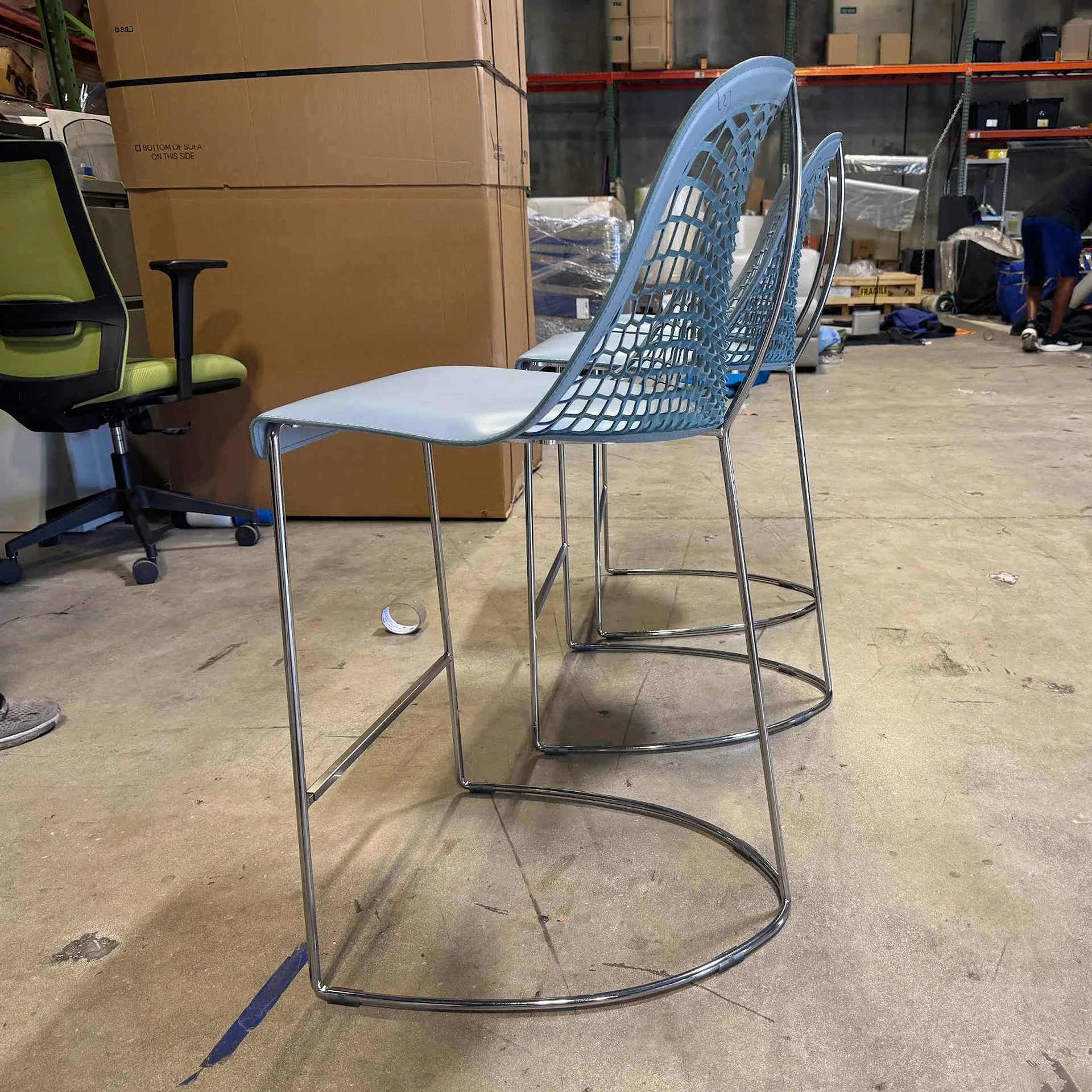 Sklar Furnishings stool with lattice back and chrome base in workshop.
