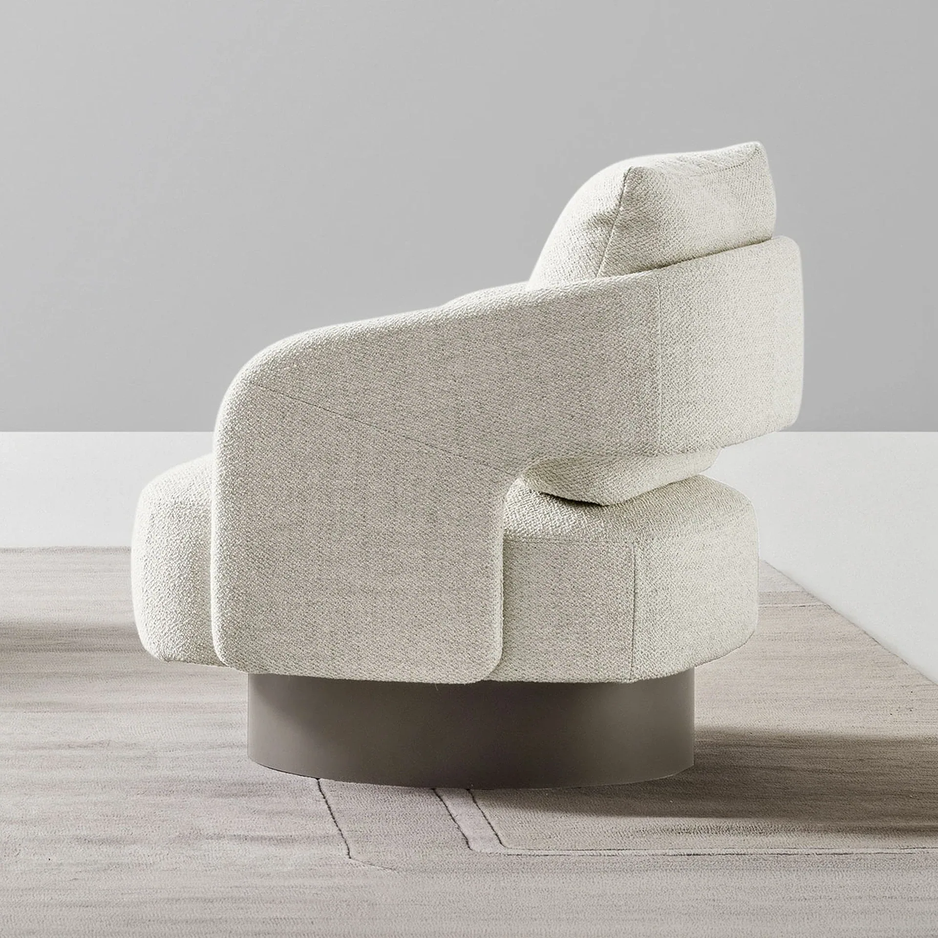 Sklar Furnishings armchair in neutral fabric with rounded back and pedestal base.