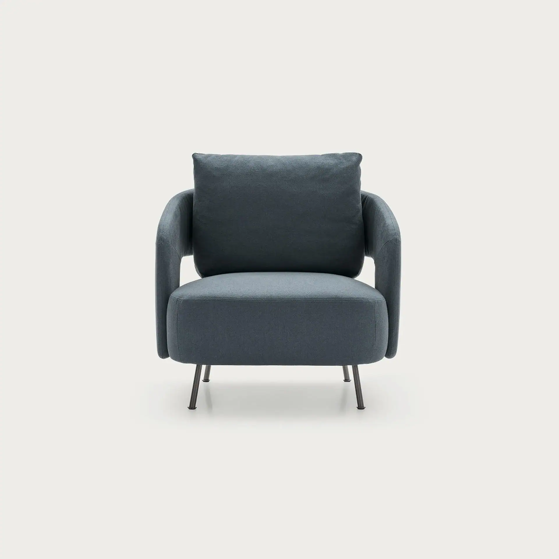 Sklar Furnishings armchair with dark blue upholstery and slender metal legs.
