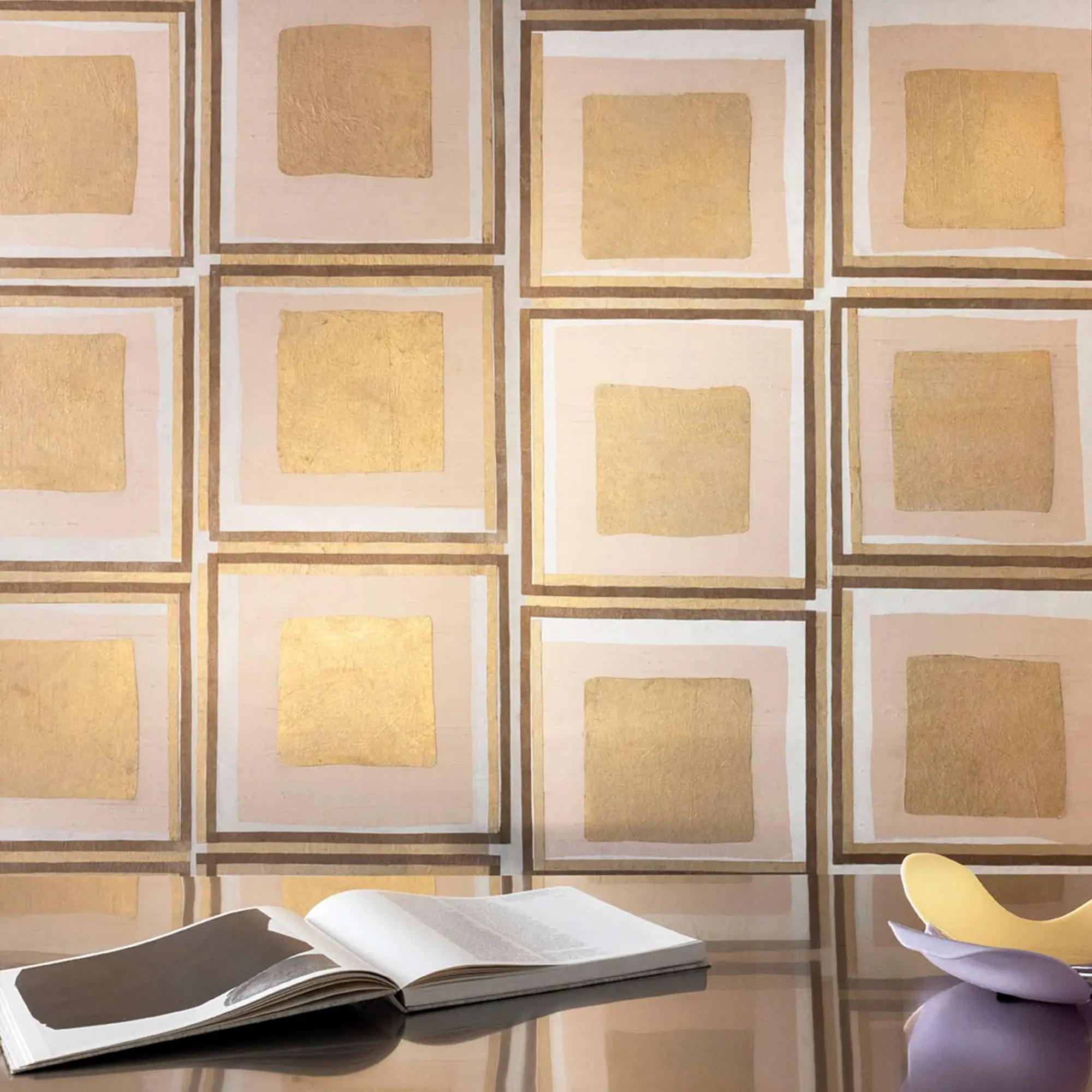 Amara wallpaper pattern with square gold and beige tiles.