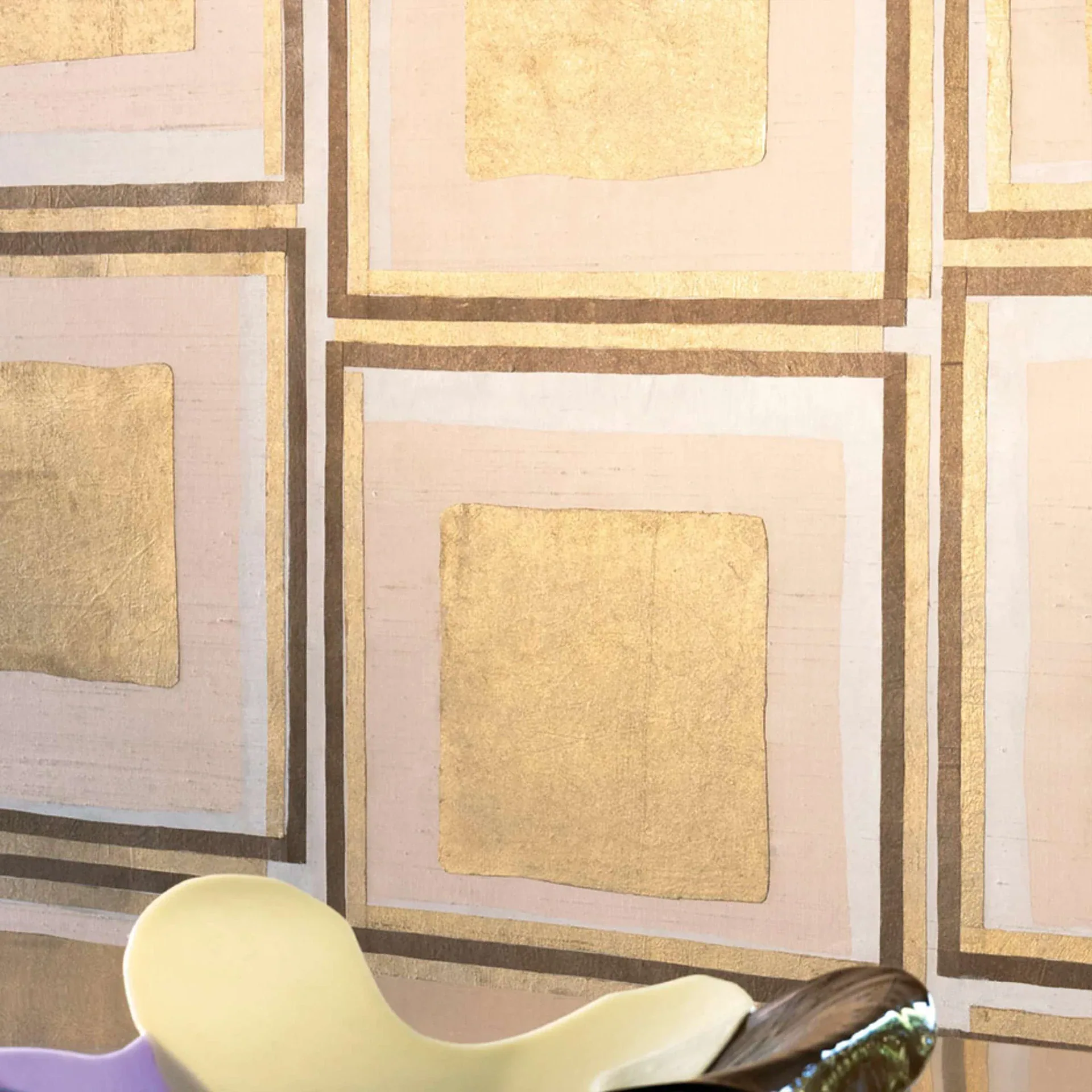 Amara wallpaper geometric pattern with pink, beige and gold squares.