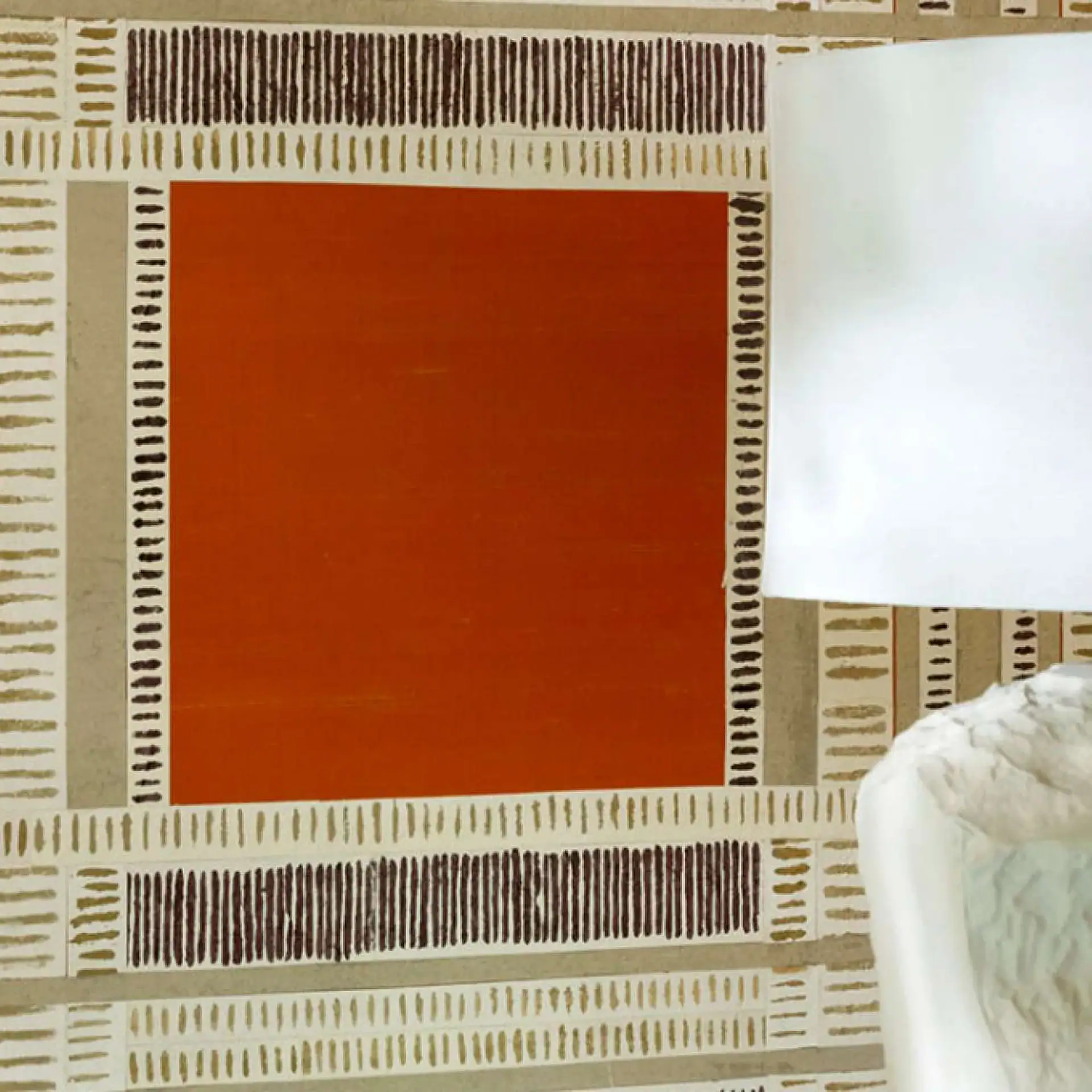 Shiraz wallpaper geometric pattern with orange block and beige accents.