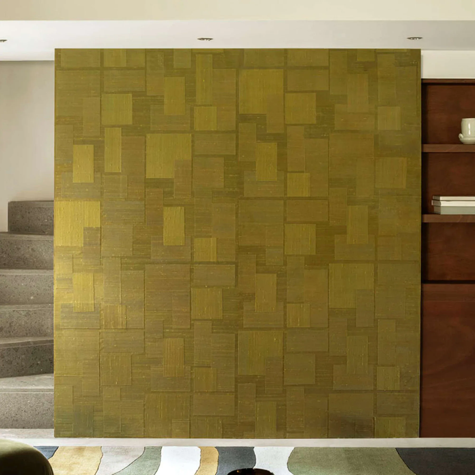 Transgression Wallpaper with geometric panel pattern in olive tones.