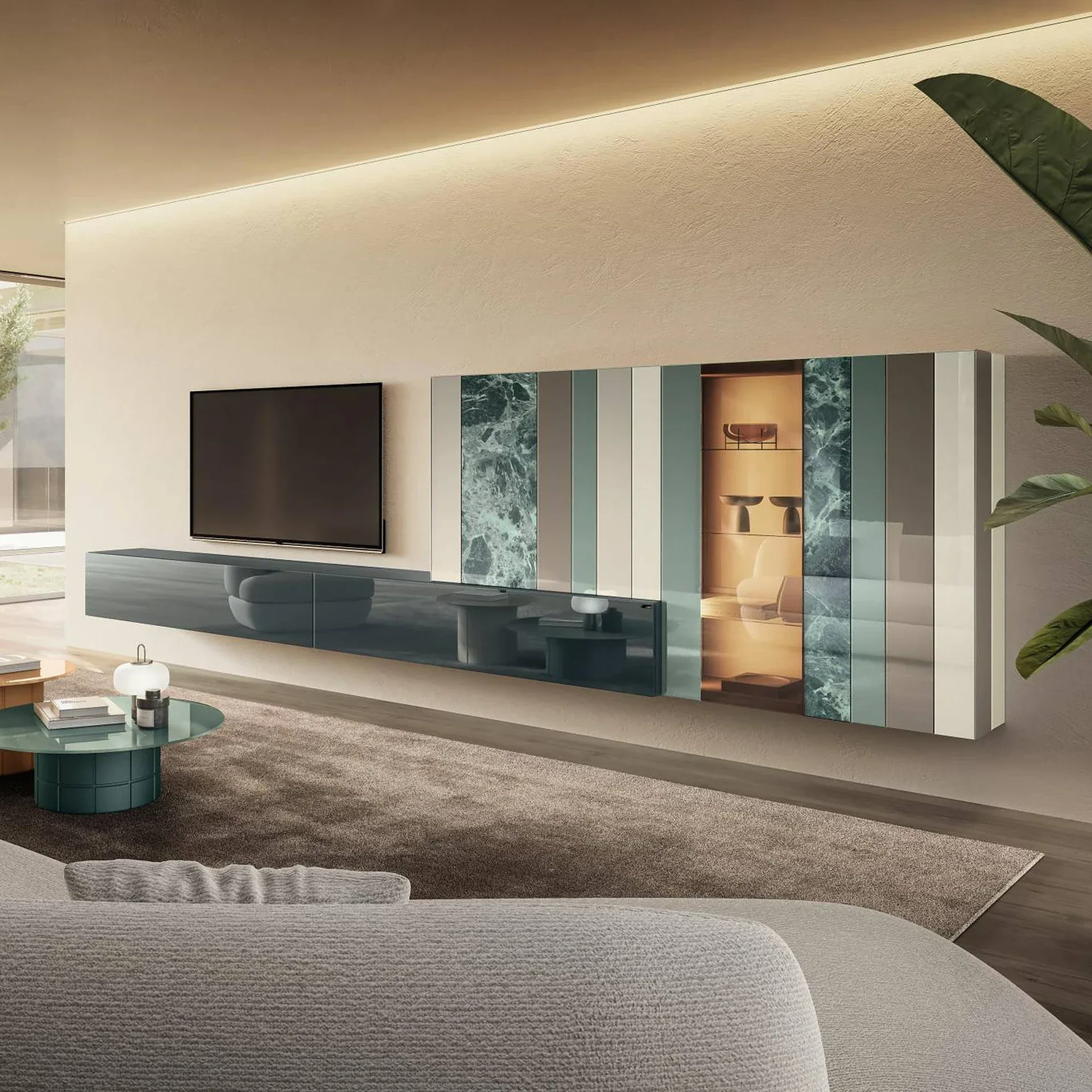 A modern living room with a wall-mounted TV, a dark teal floating media console, and a decorative wall cabinet with striped panels and an illuminated display case. A light gray sofa, two round coffee tables, and a beige rug are in the foreground.