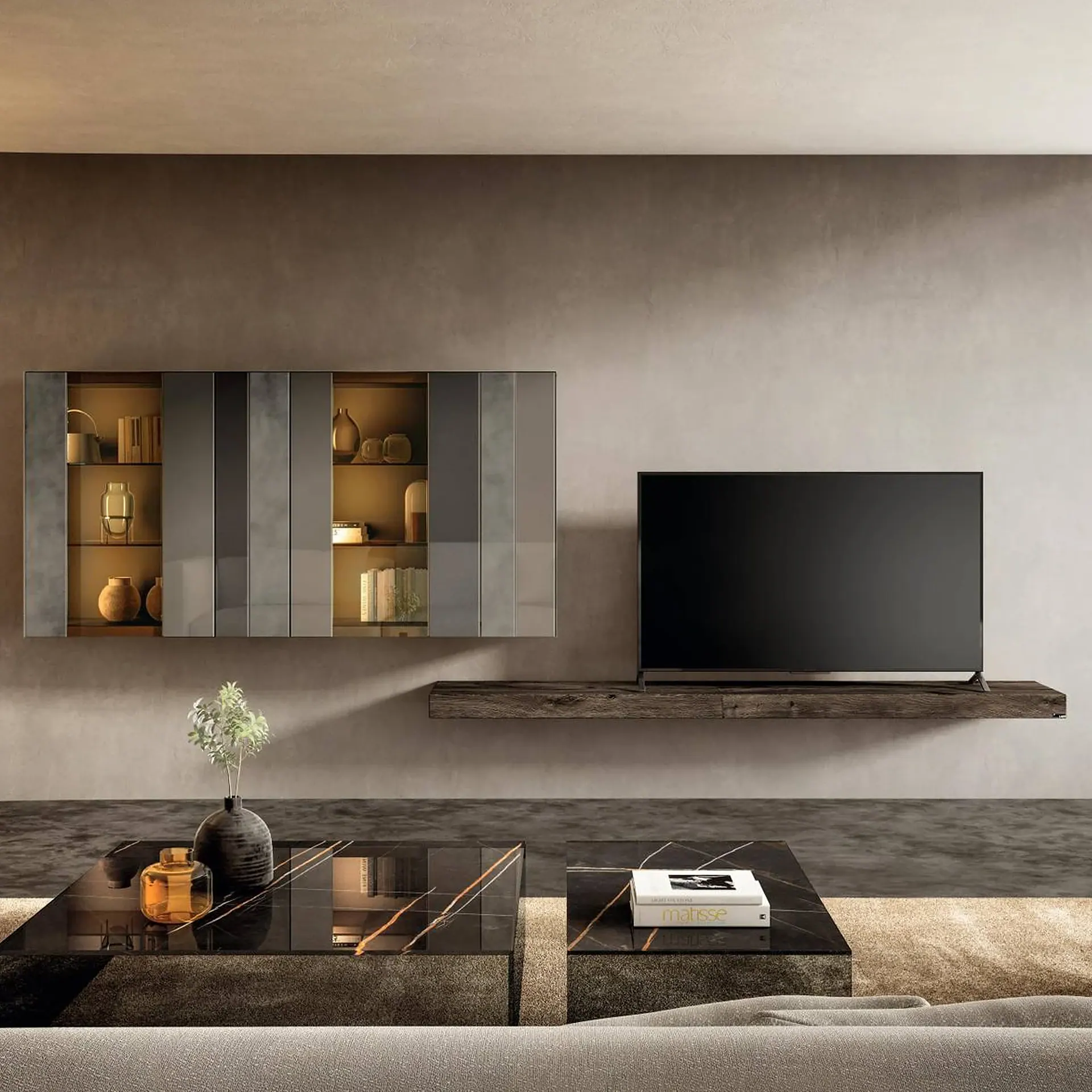 A modern living room with a wall-mounted TV, an illuminated display cabinet, and a black marble coffee table adorned with a vase and book.