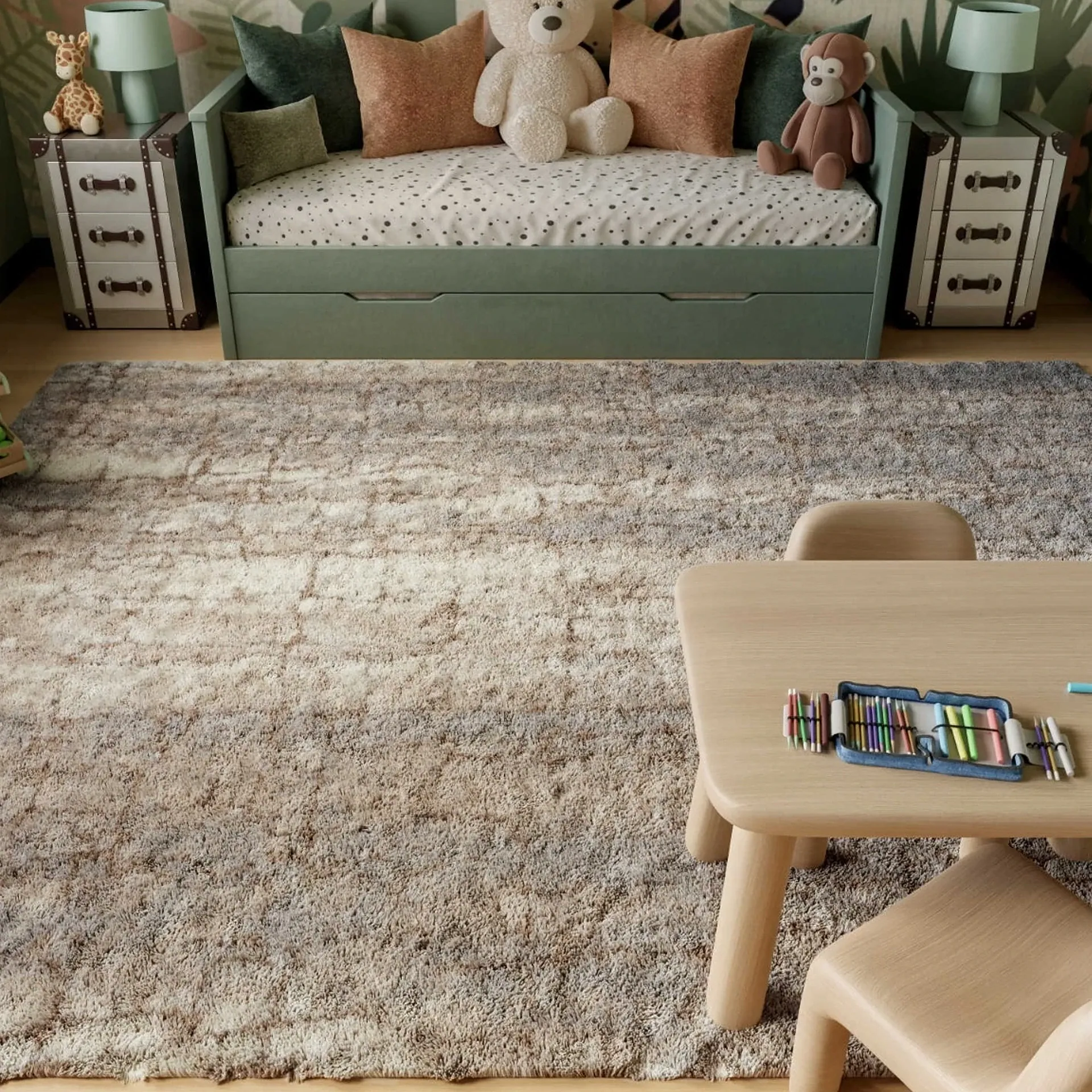 A child's room with a green daybed, two trunk nightstands with lamps, a large shaggy rug, and a wooden table with art supplies.