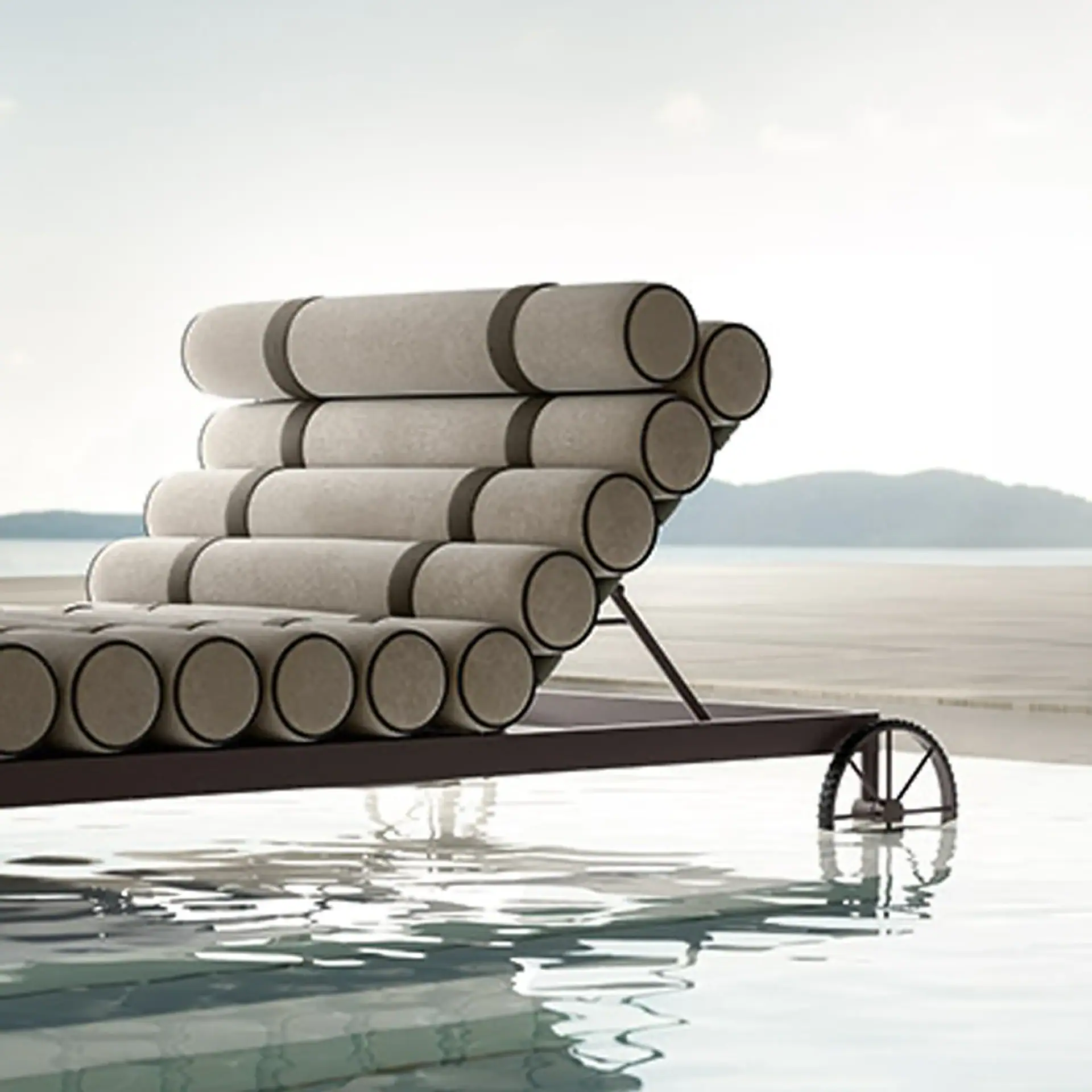 A modern chaise lounge with cylindrical cushions and a wheel, partially in water, with a distant coastline and mountains.