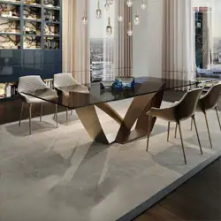 Sklar Furnishings dining table with unique geometric base in a modern dining room.