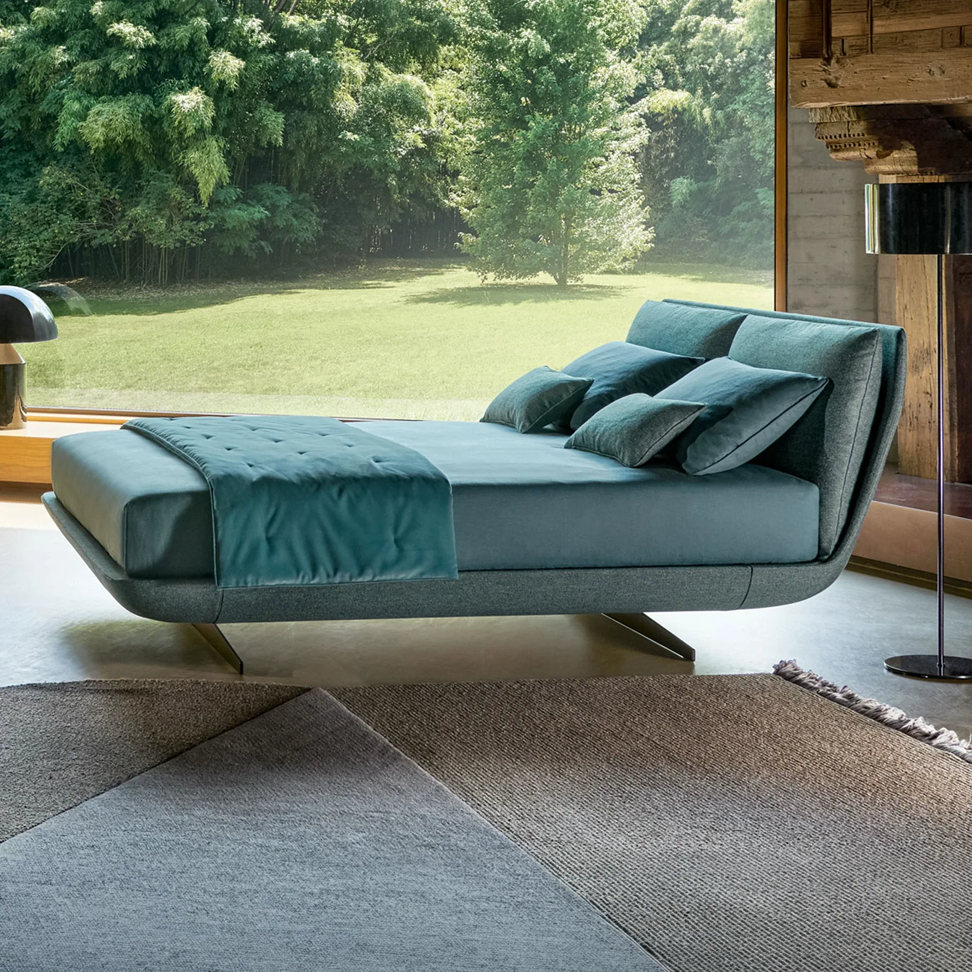 Sklar Upholstered Bed with teal bedding in a modern room.