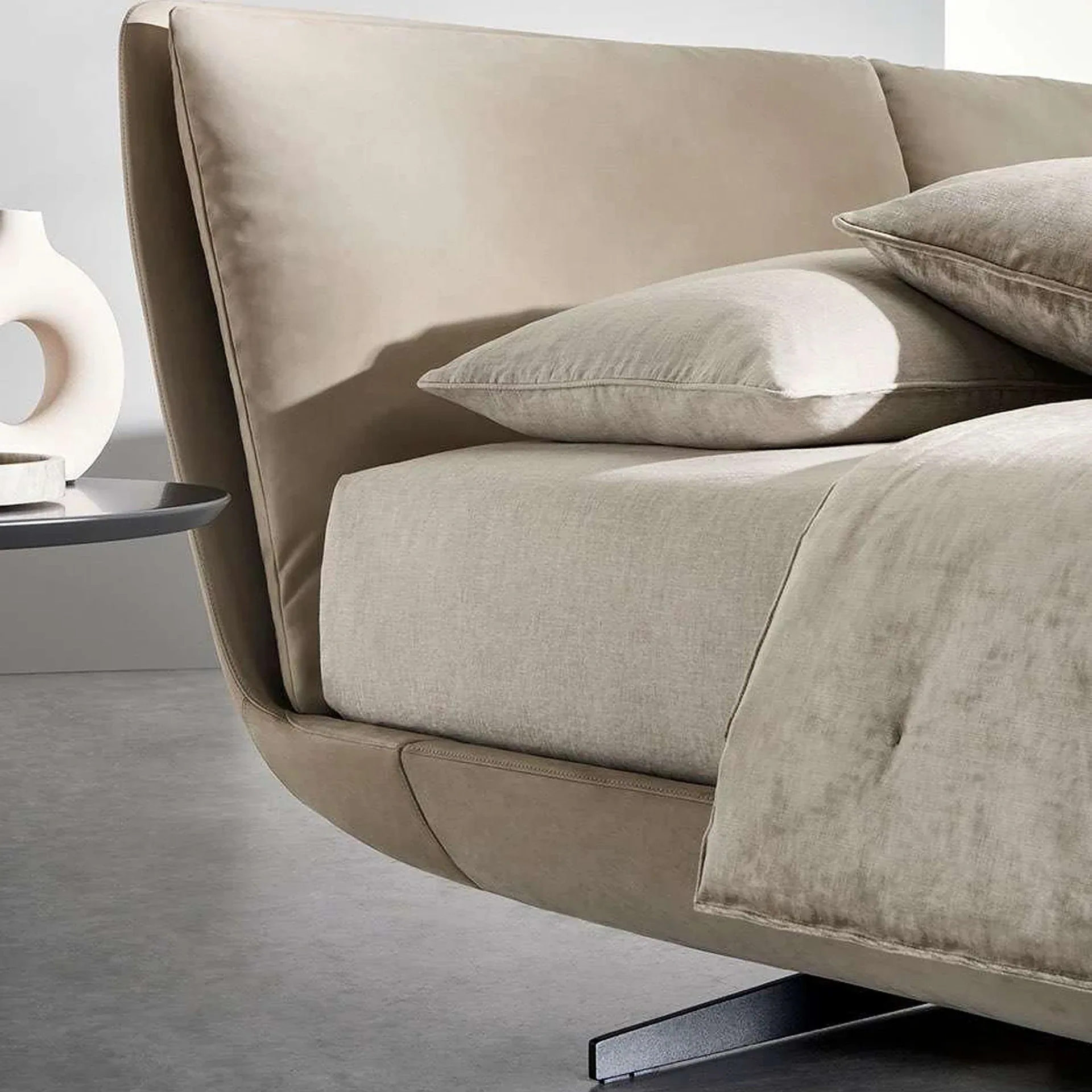 Sklar Furnishings upholstered bed with beige headboard and matching bedding in modern bedroom.